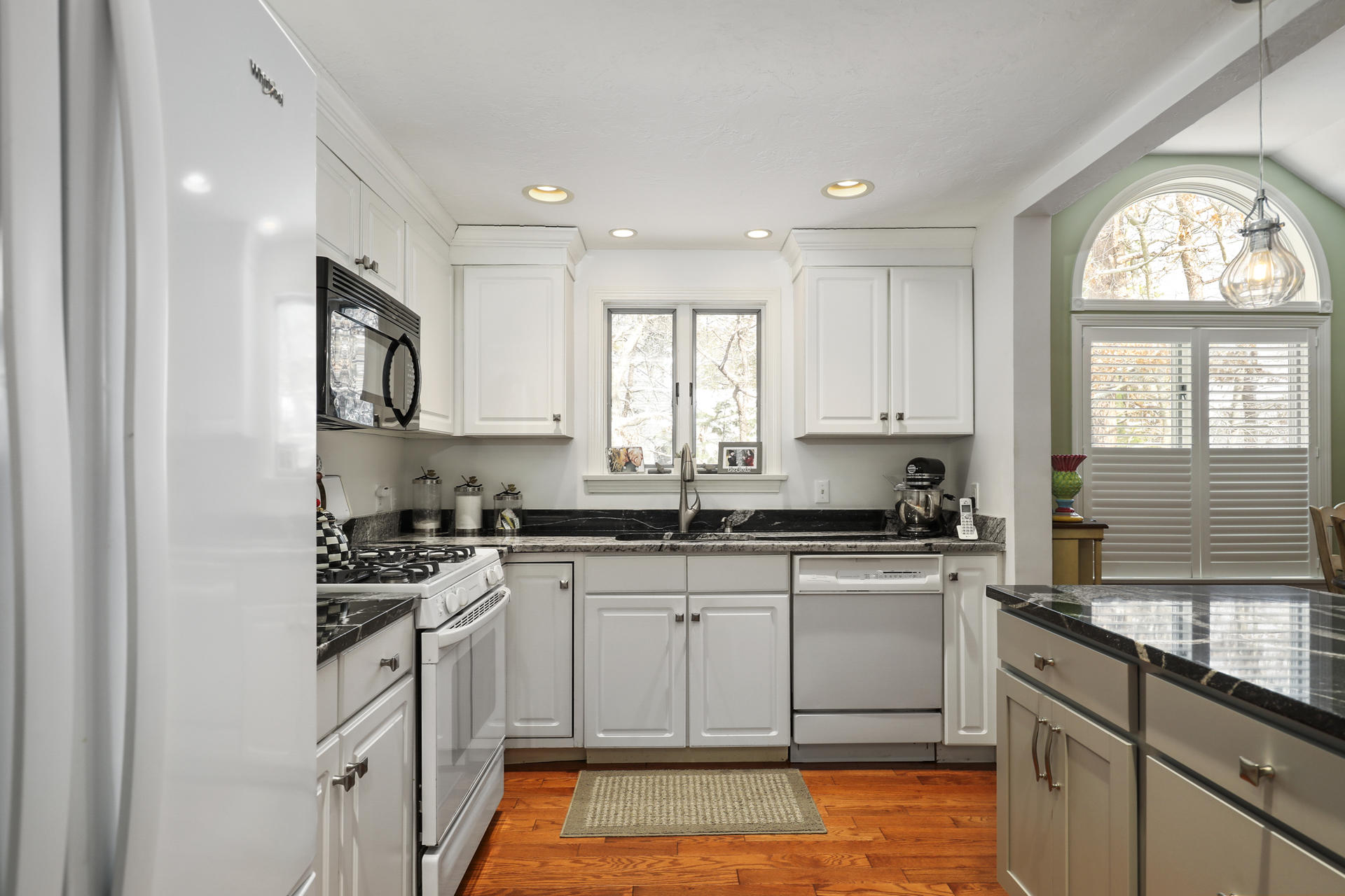 21 Portside Drive Mashpee, MA 02649 - Photo 4 of 20 a kitchen with stainless steel appliances granite countertop a stove a sink and a microwave