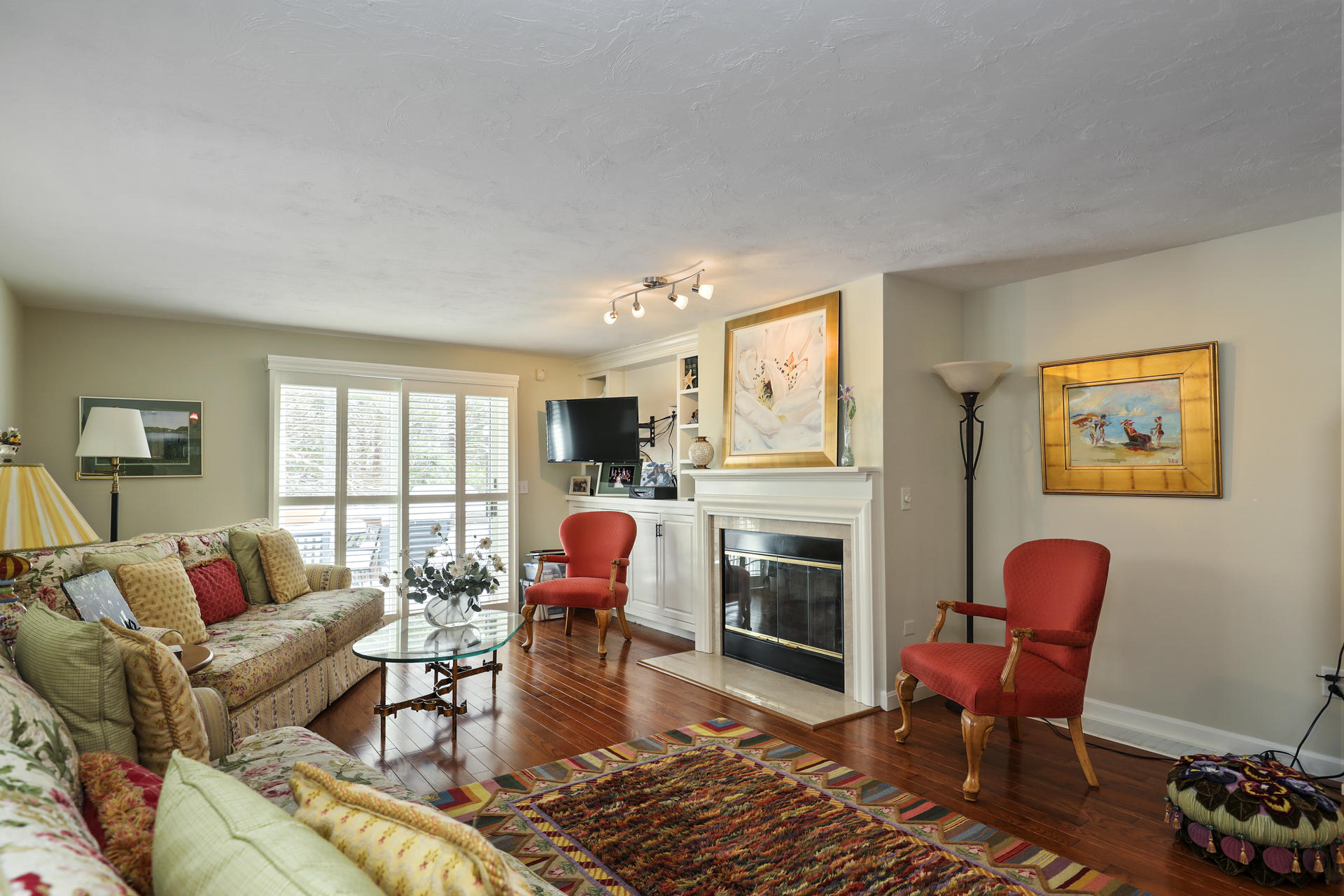 21 Portside Drive Mashpee, MA 02649 - Photo 6 of 20 a living room with furniture or couch and a fireplace