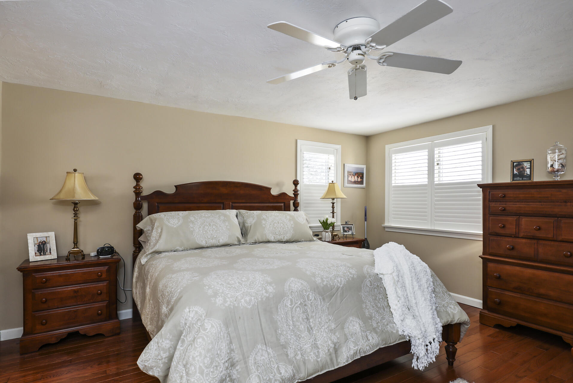 21 Portside Drive Mashpee, MA 02649 - Photo 9 of 20 a bedroom with a bed and wooden floor