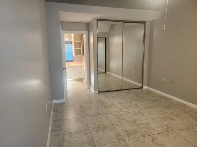 a view of a bathroom with a glass door and shower