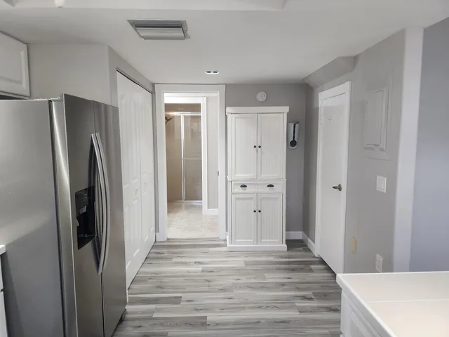 a view of a kitchen from the hallway