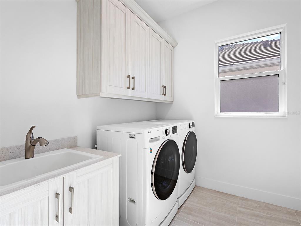 8043 Waterbend Trail Sarasota, FL 34240 - Photo 38 of 83 a utility room with dryer and washer