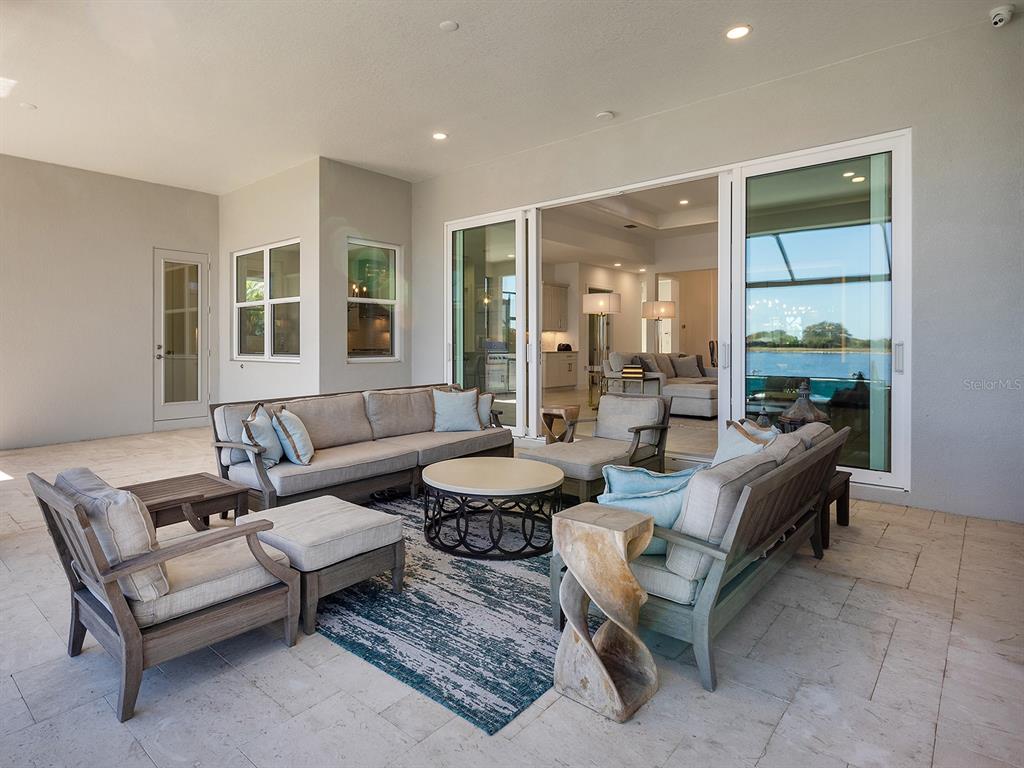 8043 Waterbend Trail Sarasota, FL 34240 - Photo 42 of 83 a living room with furniture and a large window