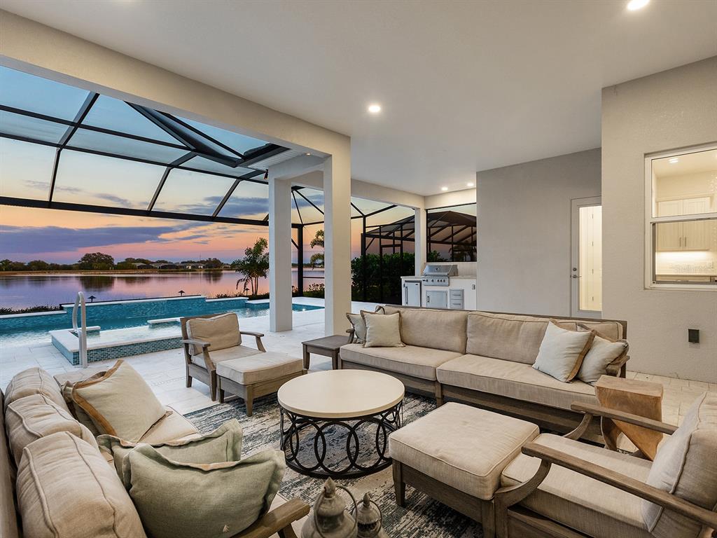 8043 Waterbend Trail Sarasota, FL 34240 - Photo 43 of 83 a living room with furniture and a large window