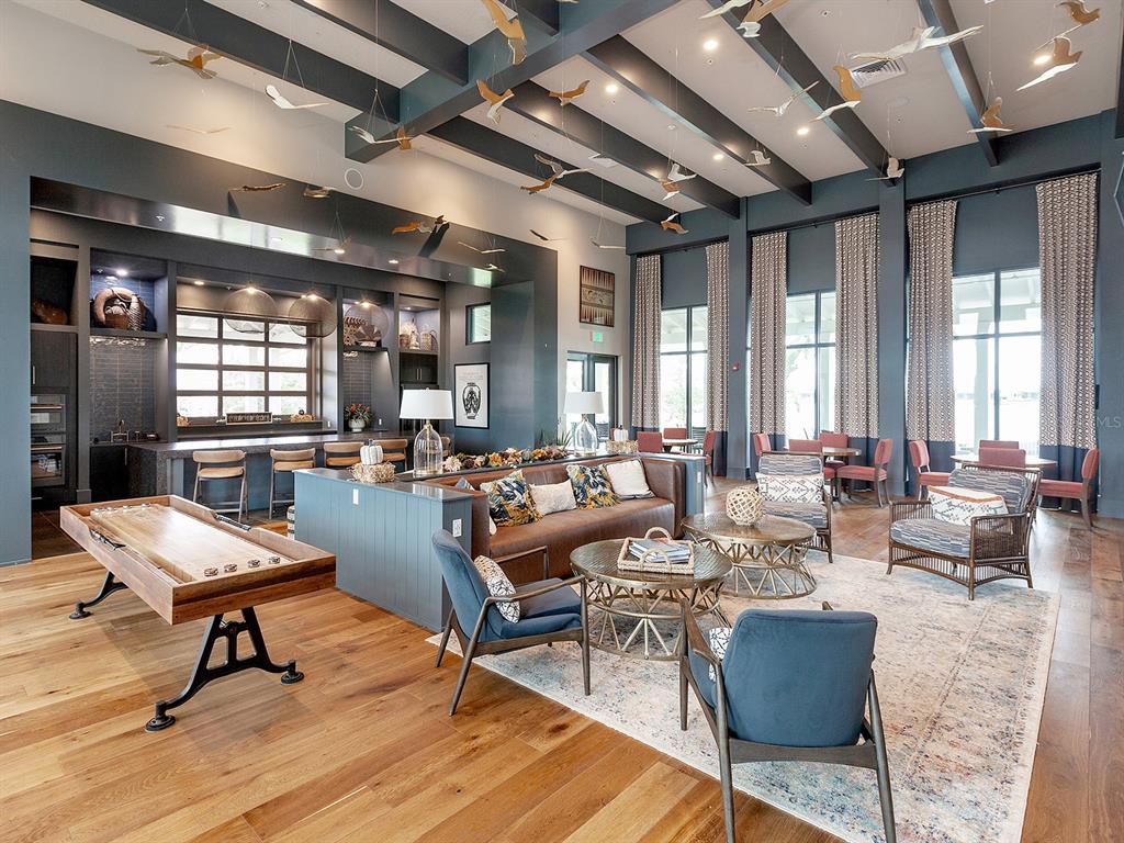 8043 Waterbend Trail Sarasota, FL 34240 - Photo 69 of 83 a living room with lots of furniture and a large window