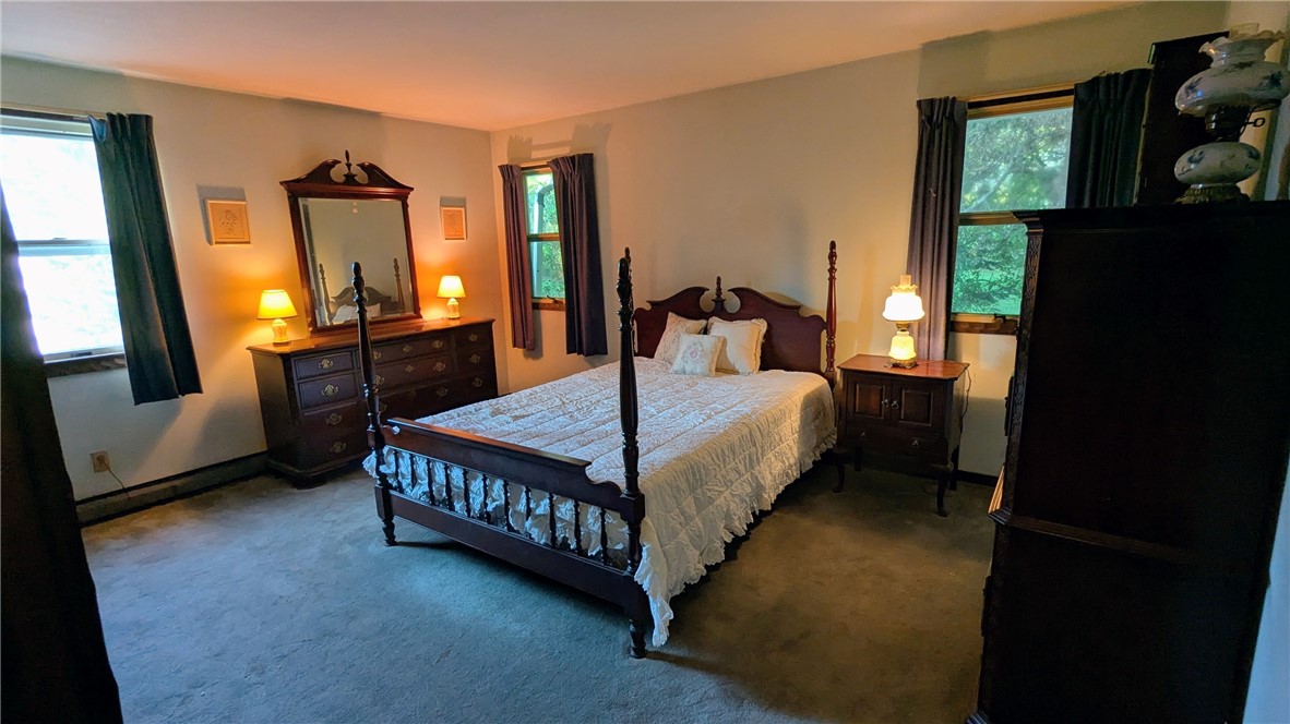 158 Cross Road Otego, NY 13825 - Photo 27 of 50 Light main bedroom with windows framing country v