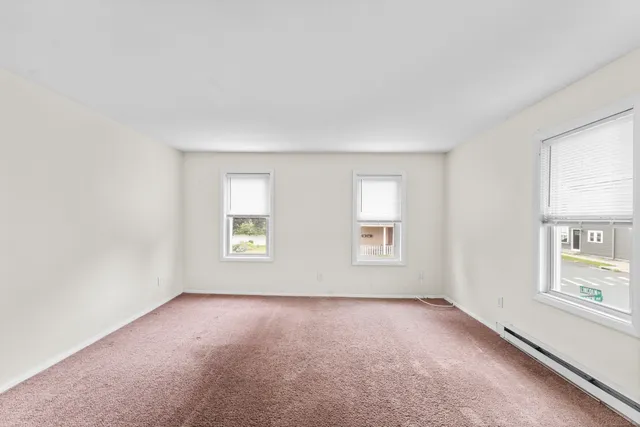 an empty room with windows