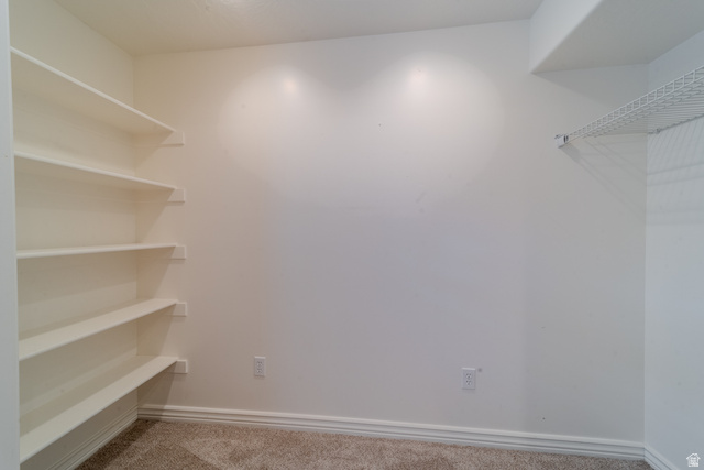598 Hollow Creek Road Draper, UT 84020 - Photo 46 of 110 Interior space with built-in shelving, white walls, and plush carpet flooring