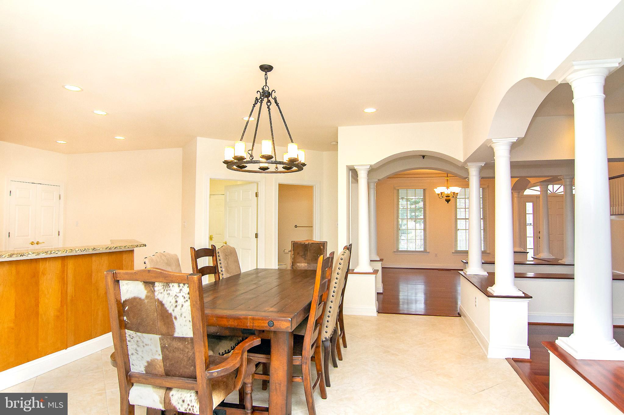 2089 Brown Road Finksburg, MD 21048 - Photo 11 of 31 a view of a dining room with furniture a chandelier and wooden floor
