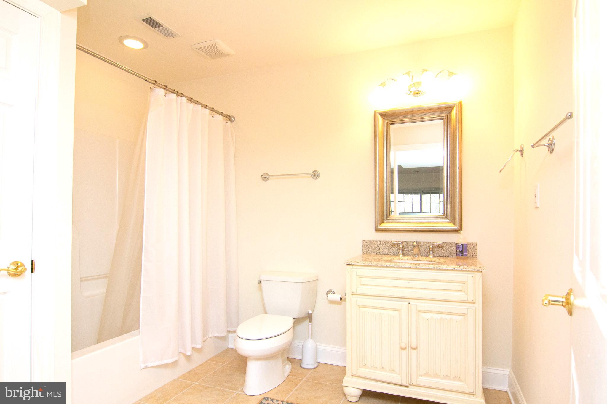 2089 Brown Road Finksburg, MD 21048 - Photo 30 of 31 a bathroom with a toilet sink and a mirror