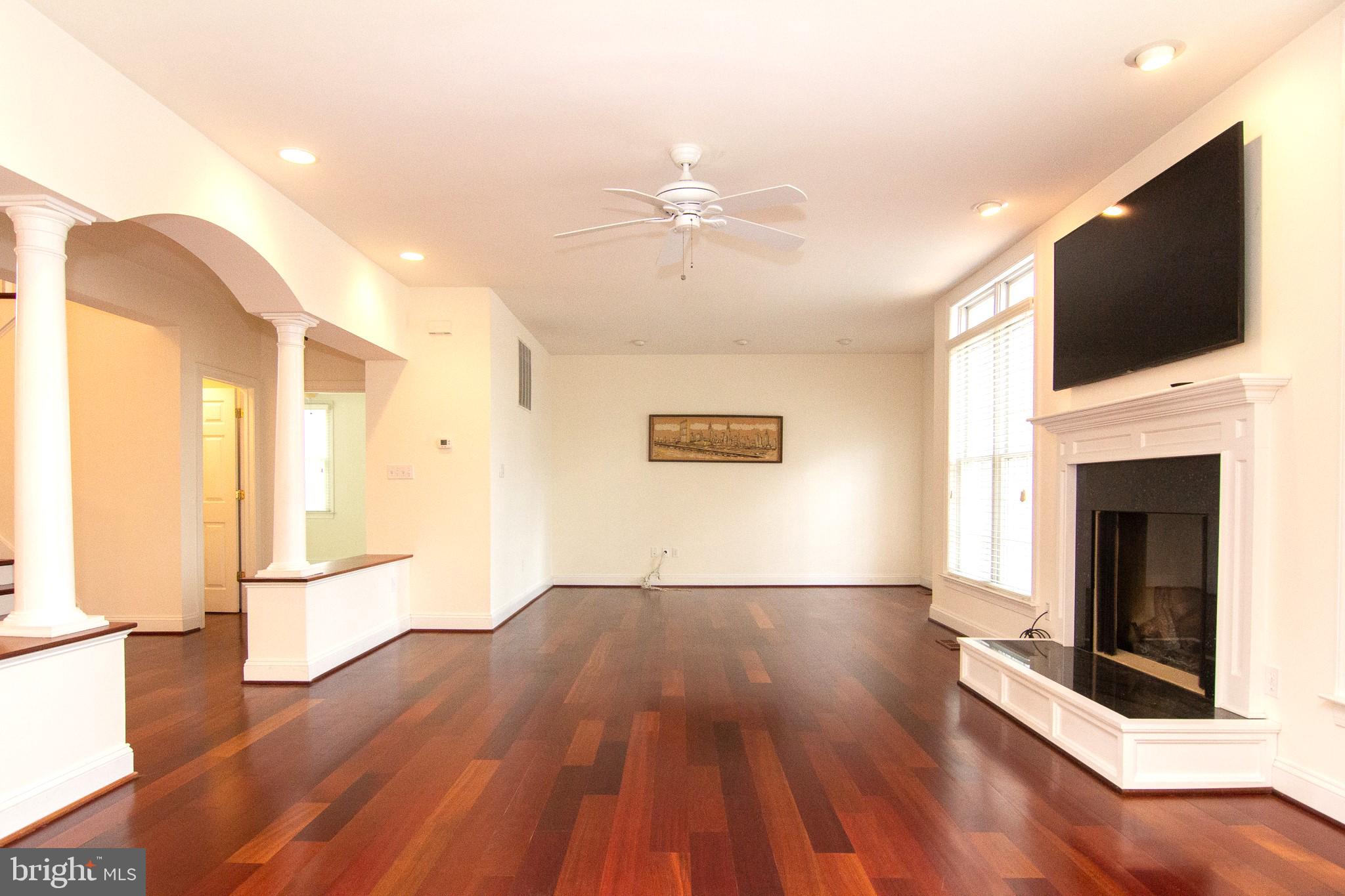 2089 Brown Road Finksburg, MD 21048 - Photo 7 of 31 a view of a livingroom with wooden floor and a fireplace