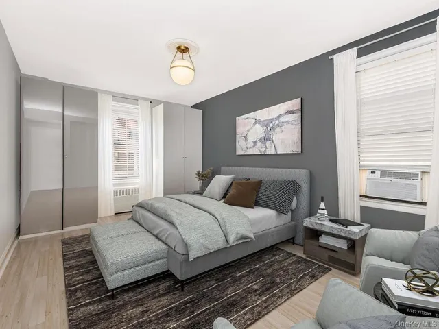 a spacious bedroom with a bed and a couch