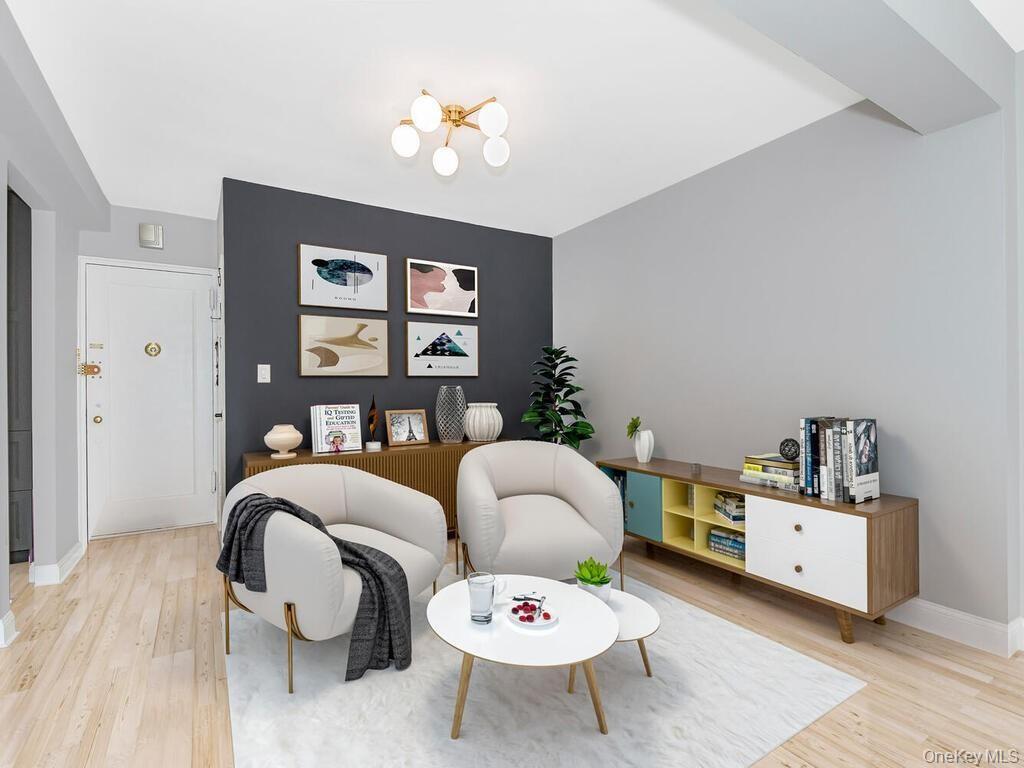 645 West 239th Street, Unit 4D Bronx, NY 10463 - Photo 4 of 13 Sitting room featuring light wood finished floors and a chandelier