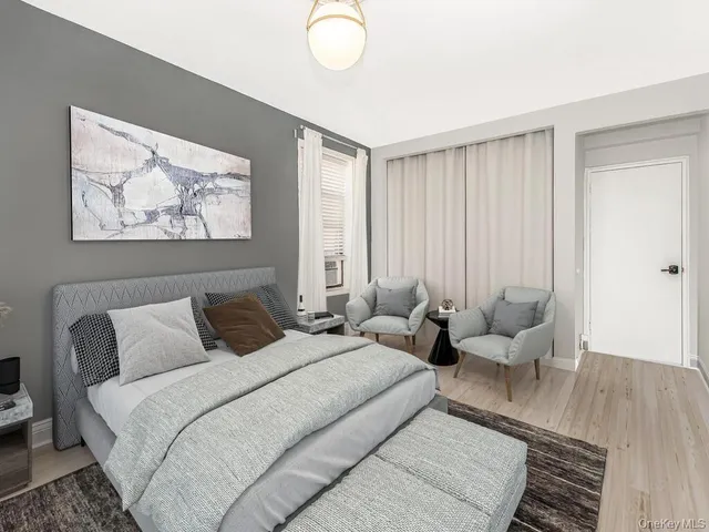 a bedroom with bed and window