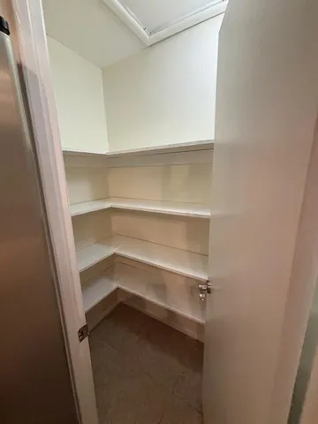 a view of an empty walk in closet