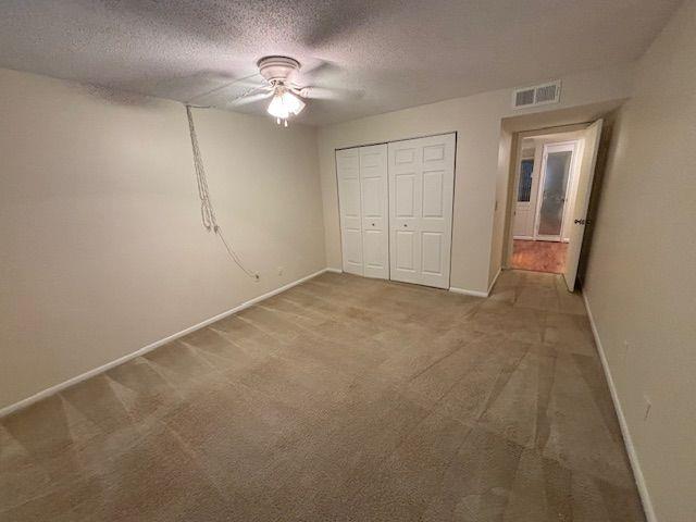 38 Rumson Court Smyrna, GA 30080 - Photo 26 of 38 an empty room with a chandelier fan and windows