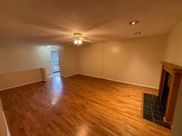 a view of a livingroom with wooden floor