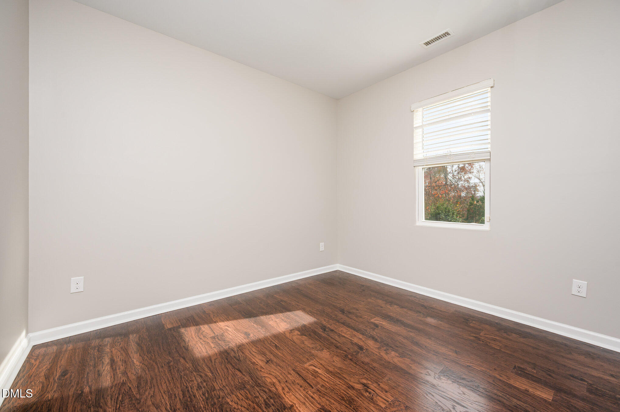 18 Dover Ridge Court Chapel Hill, NC 27517 - Photo 18 of 40 an empty room with wooden floor and windows