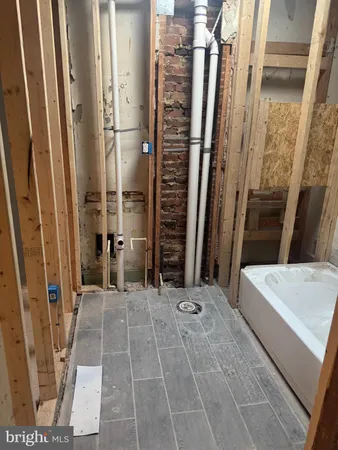 a view of bathroom with a tub and shower
