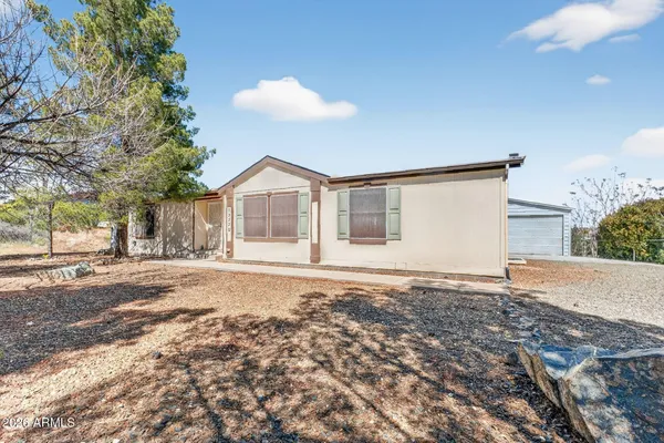 a house with trees in the background