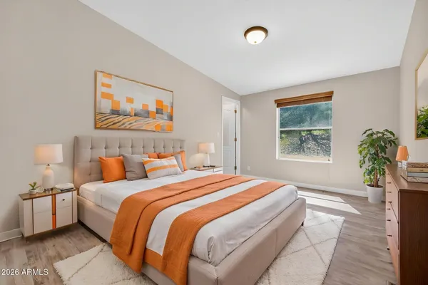 a bedroom with bed and window