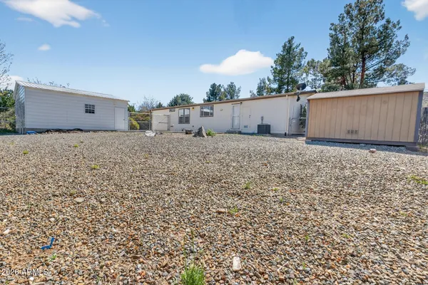 a house view with a backyard space