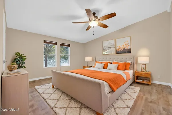 a bedroom with a large bed and a window