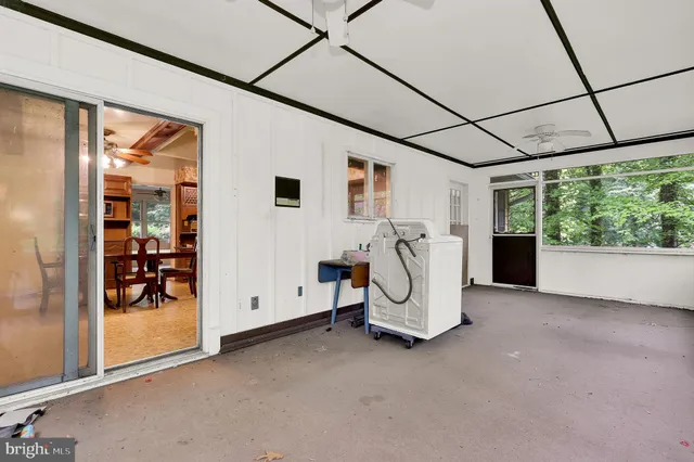 a view of a livingroom with furniture and a window