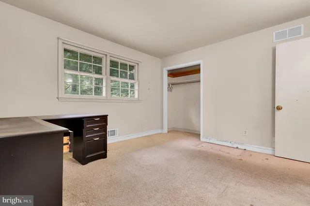 an empty room with windows