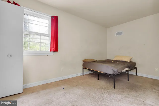 a room with a table and a window