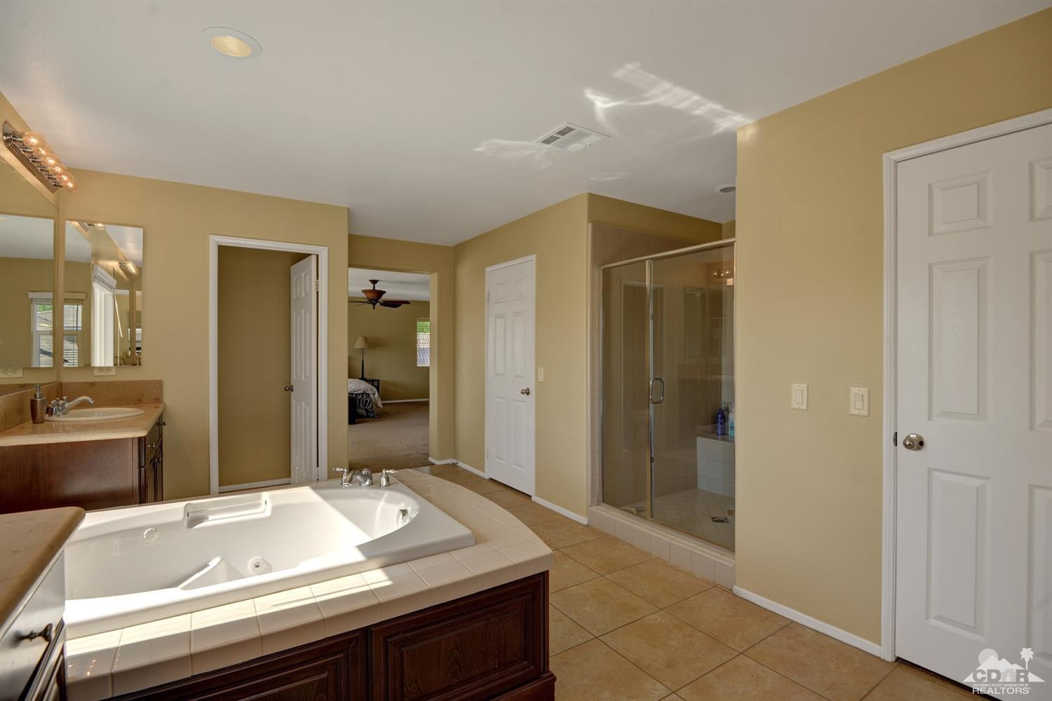 37458 Blackburn Road Indio, CA 92203 - Photo 14 of 33 a bathroom with a sink and a mirror