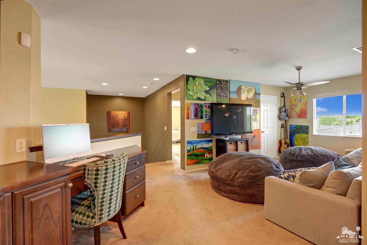 37458 Blackburn Road Indio, CA 92203 - Photo 22 of 33 a living room with furniture and a flat screen tv