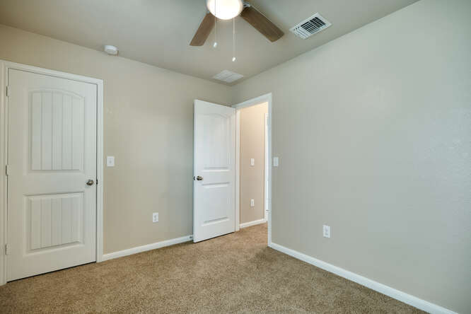 232 Voss Kyle, TX 78640 - Photo 12 of 15 Carpeted room featuring neutral wall tones and a ceiling fan