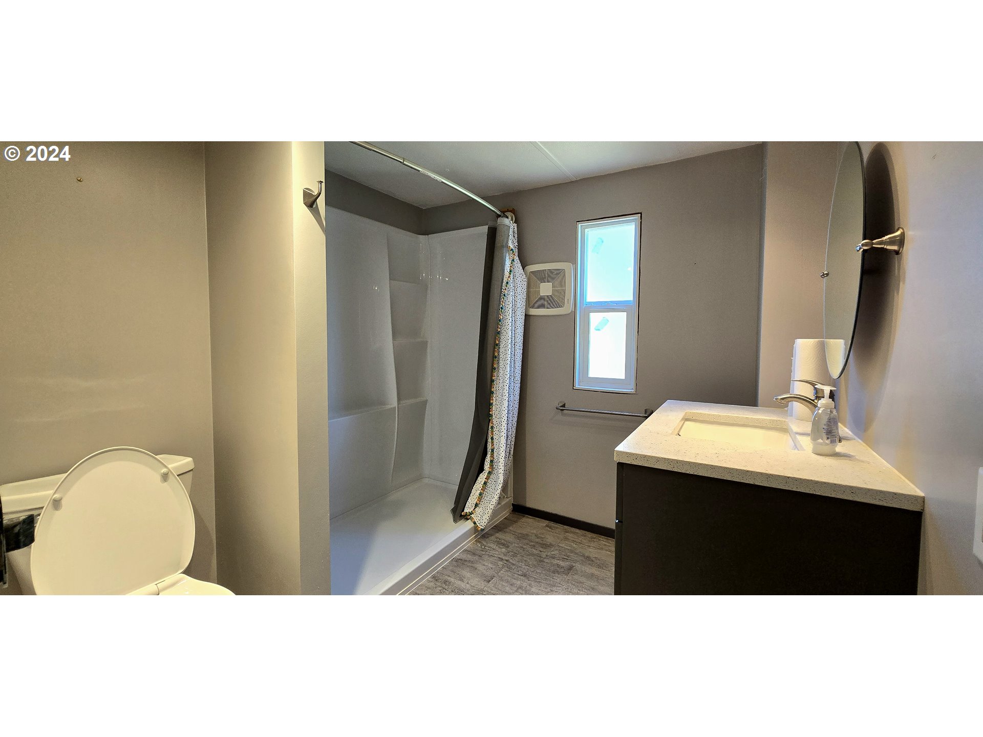 7080 Thurston Road, Unit 12 Springfield, OR 97478 - Photo 5 of 13 a bathroom with a sink mirror and toilet