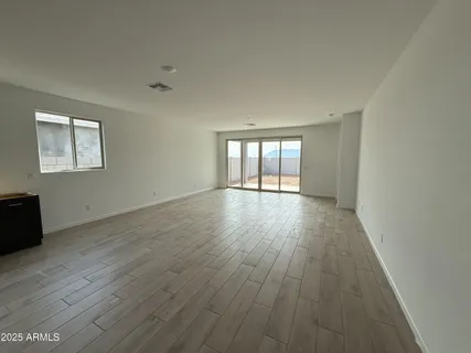 a view of kitchen and hall with wooden floor