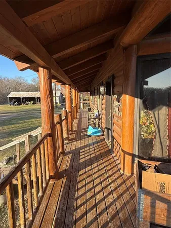 a view of balcony with wooden floor