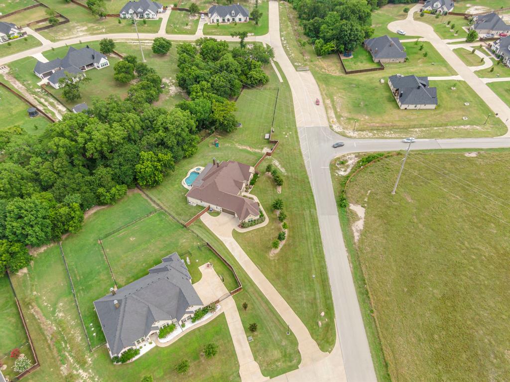 1310 Rustic Ridge Drive Midlothian, TX 76065 - Photo 2 of 36 an aerial view of a residential houses with outdoor space and a lake view