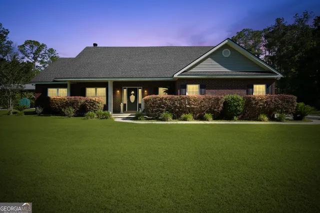 a front view of a house with a yard