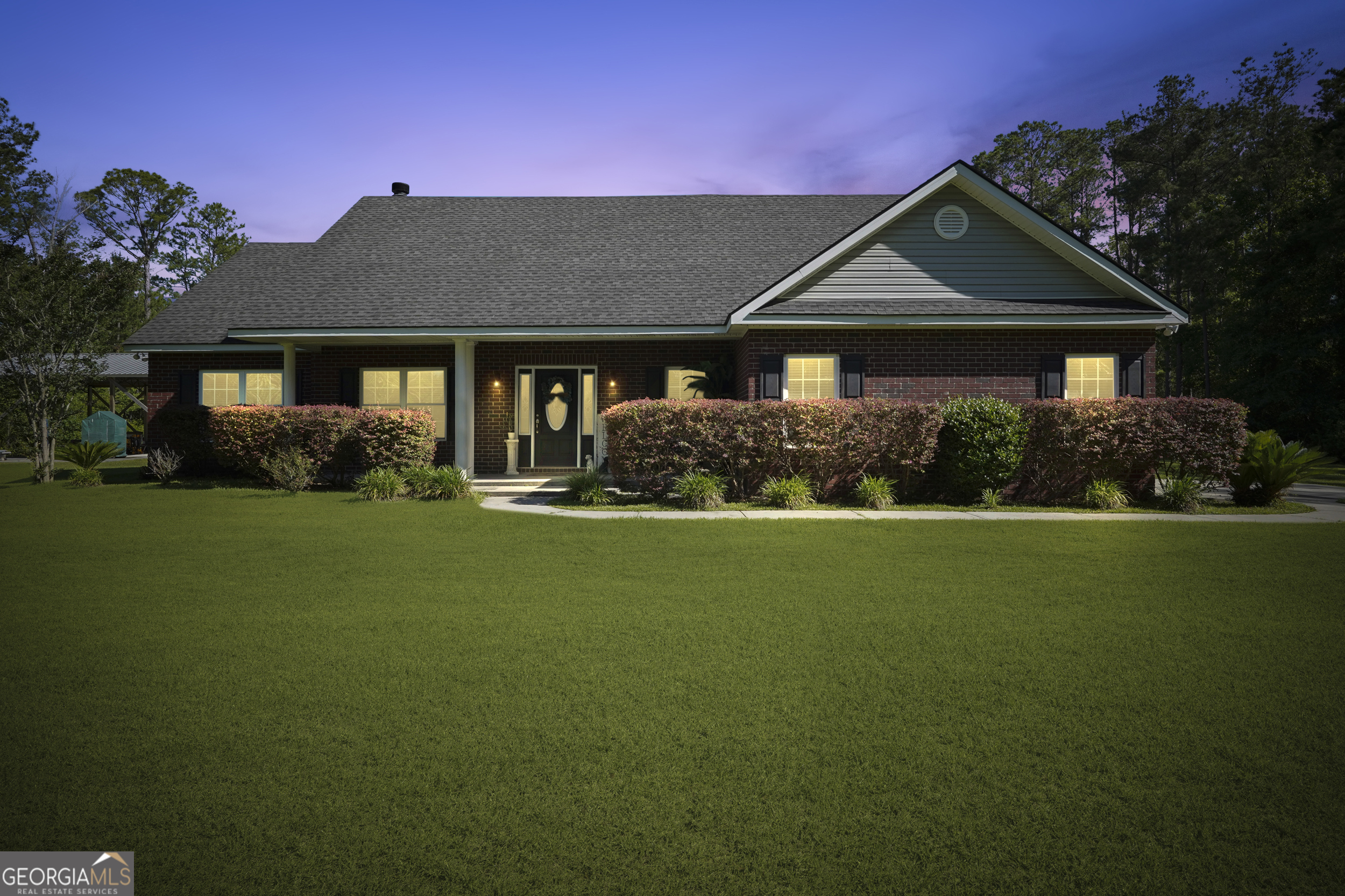 a front view of a house with a yard