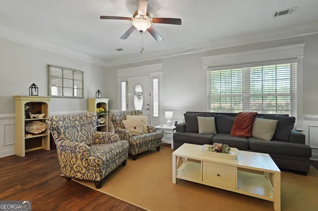 a kitchen with granite countertop a sink appliances and cabinets