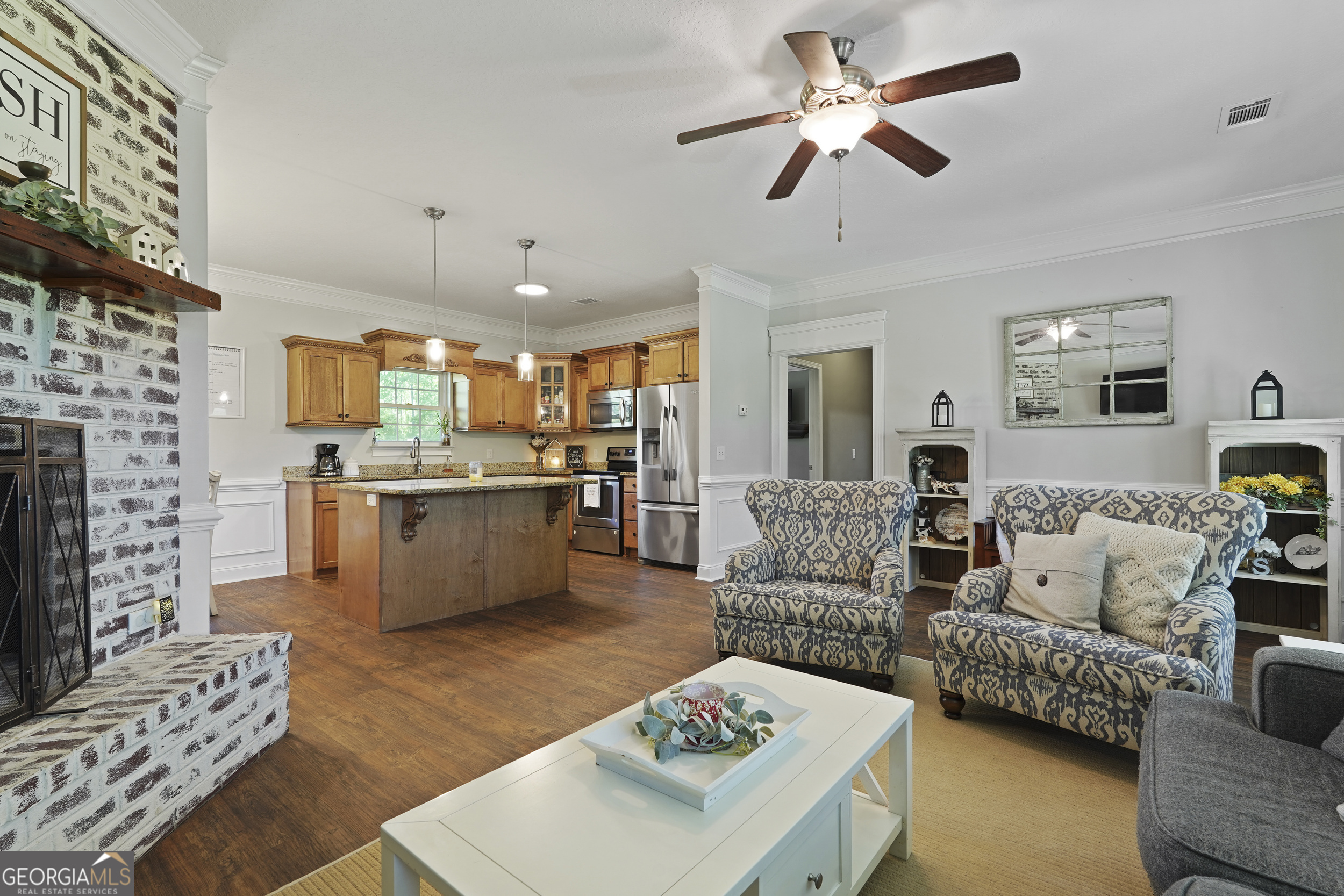 1653 Sutherland Road Townsend, GA 31331 - Photo 14 of 73 a living room with furniture kitchen view and a fireplace