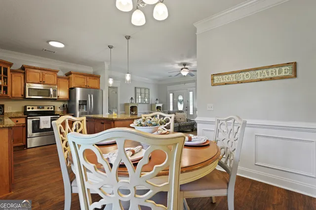 a kitchen with stainless steel appliances granite countertop a stove a refrigerator and a sink