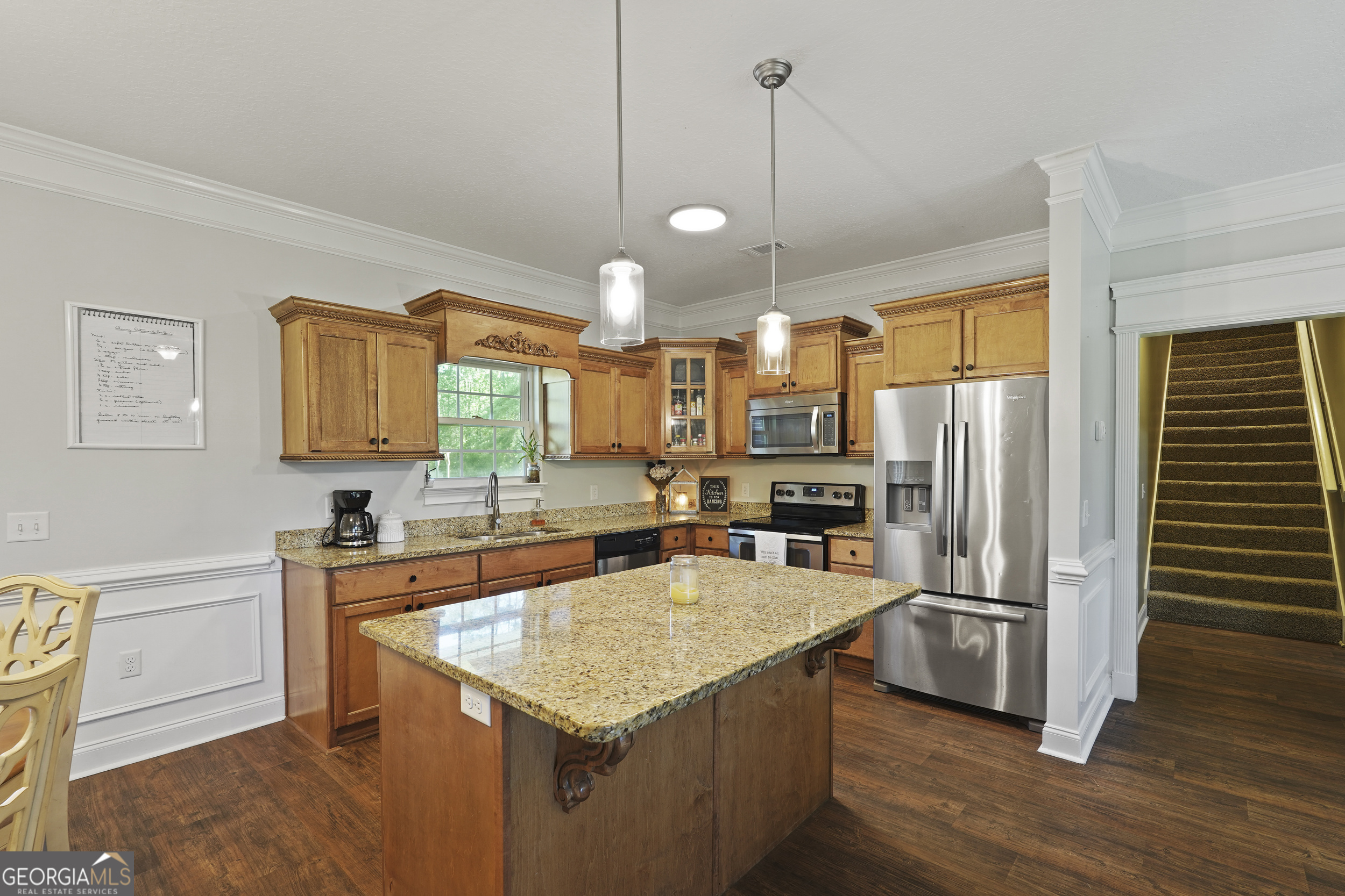 1653 Sutherland Road Townsend, GA 31331 - Photo 20 of 73 a kitchen with granite countertop a sink appliances and cabinets