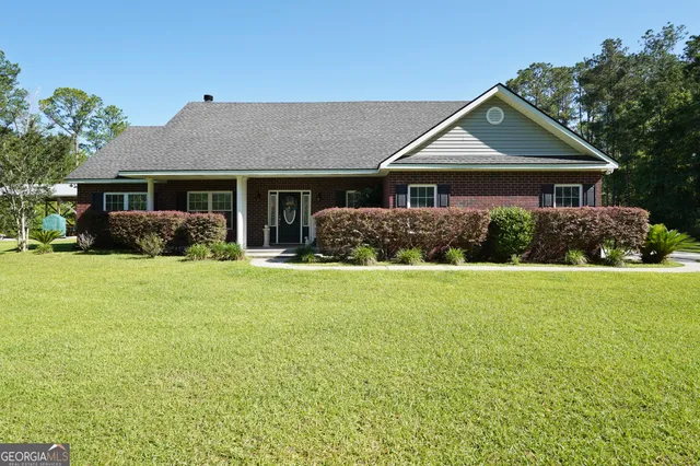 a front view of a house with garden