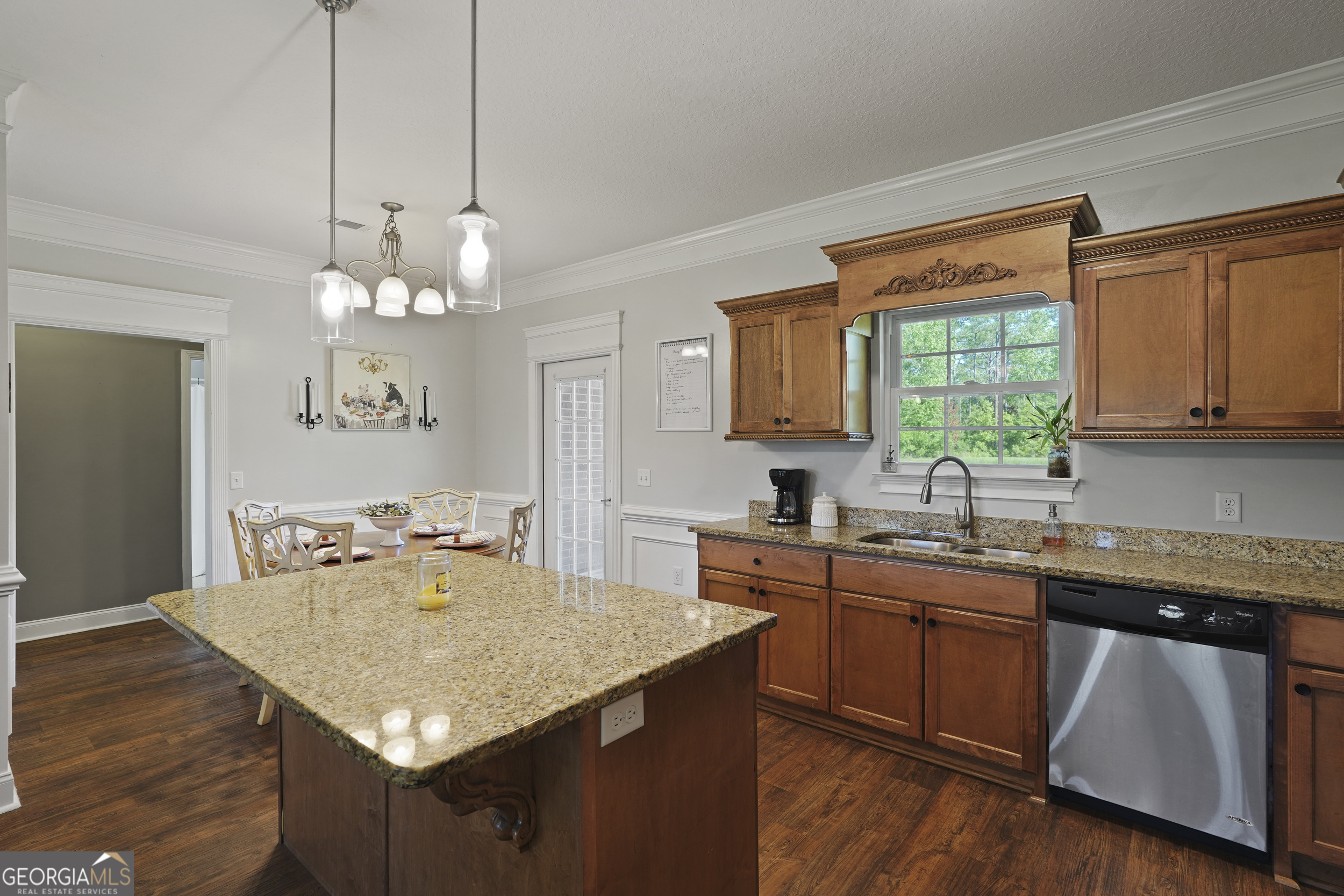 1653 Sutherland Road Townsend, GA 31331 - Photo 22 of 73 a kitchen with a sink a center island cabinets and wooden floor
