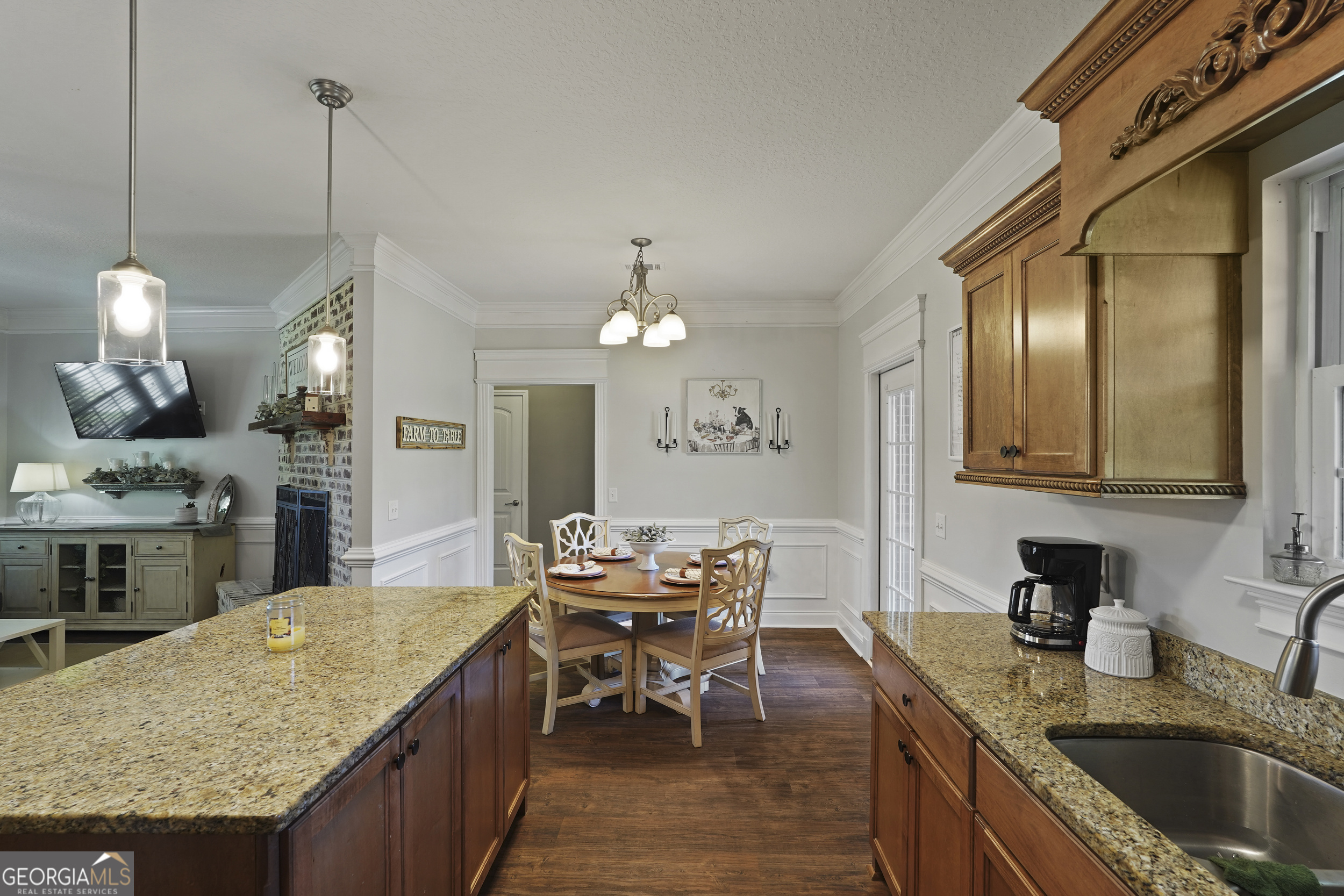 1653 Sutherland Road Townsend, GA 31331 - Photo 24 of 73 a kitchen with granite countertop kitchen island stainless steel appliances a sink stove and living room