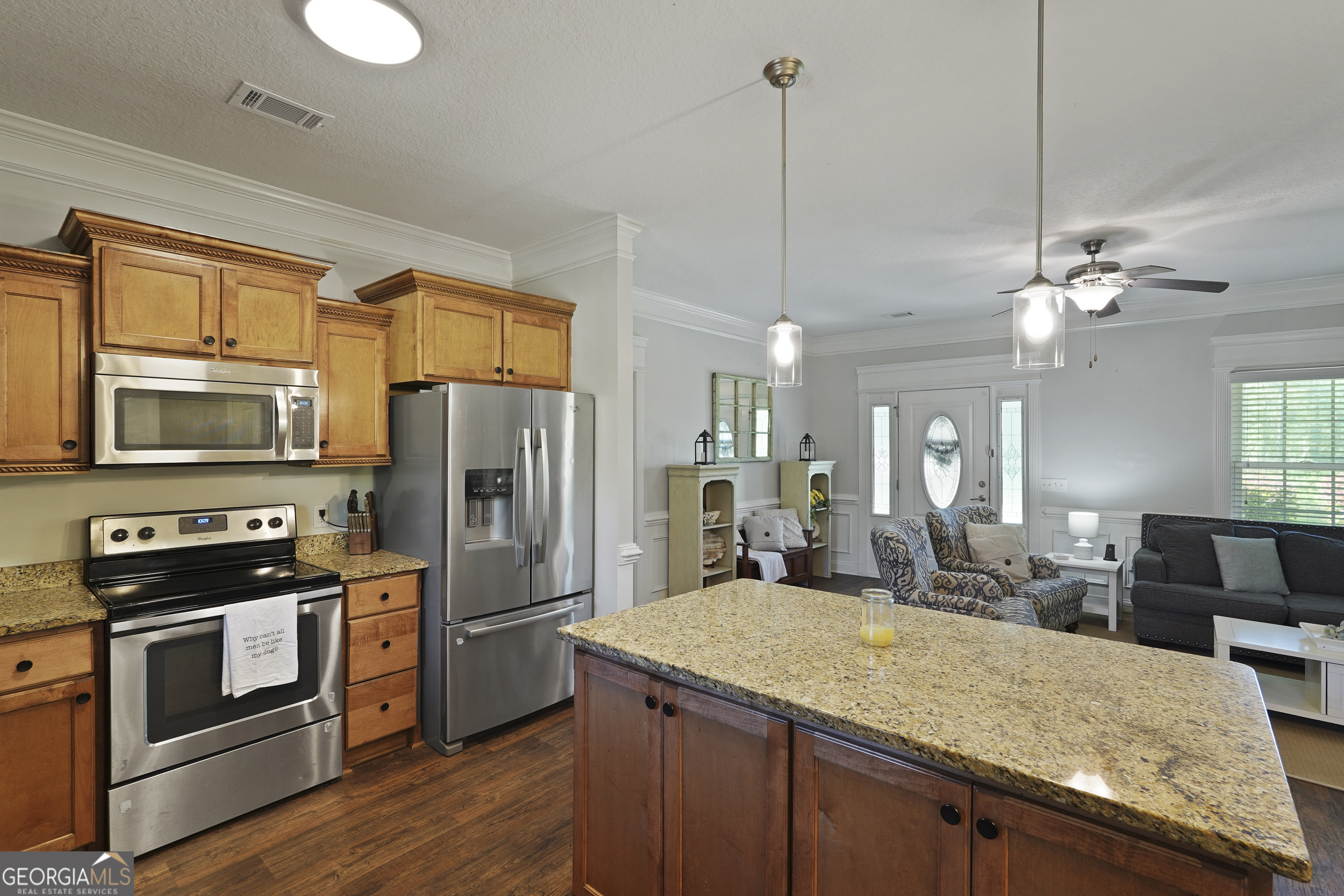 1653 Sutherland Road Townsend, GA 31331 - Photo 25 of 73 a kitchen with stainless steel appliances granite countertop a sink refrigerator and cabinets