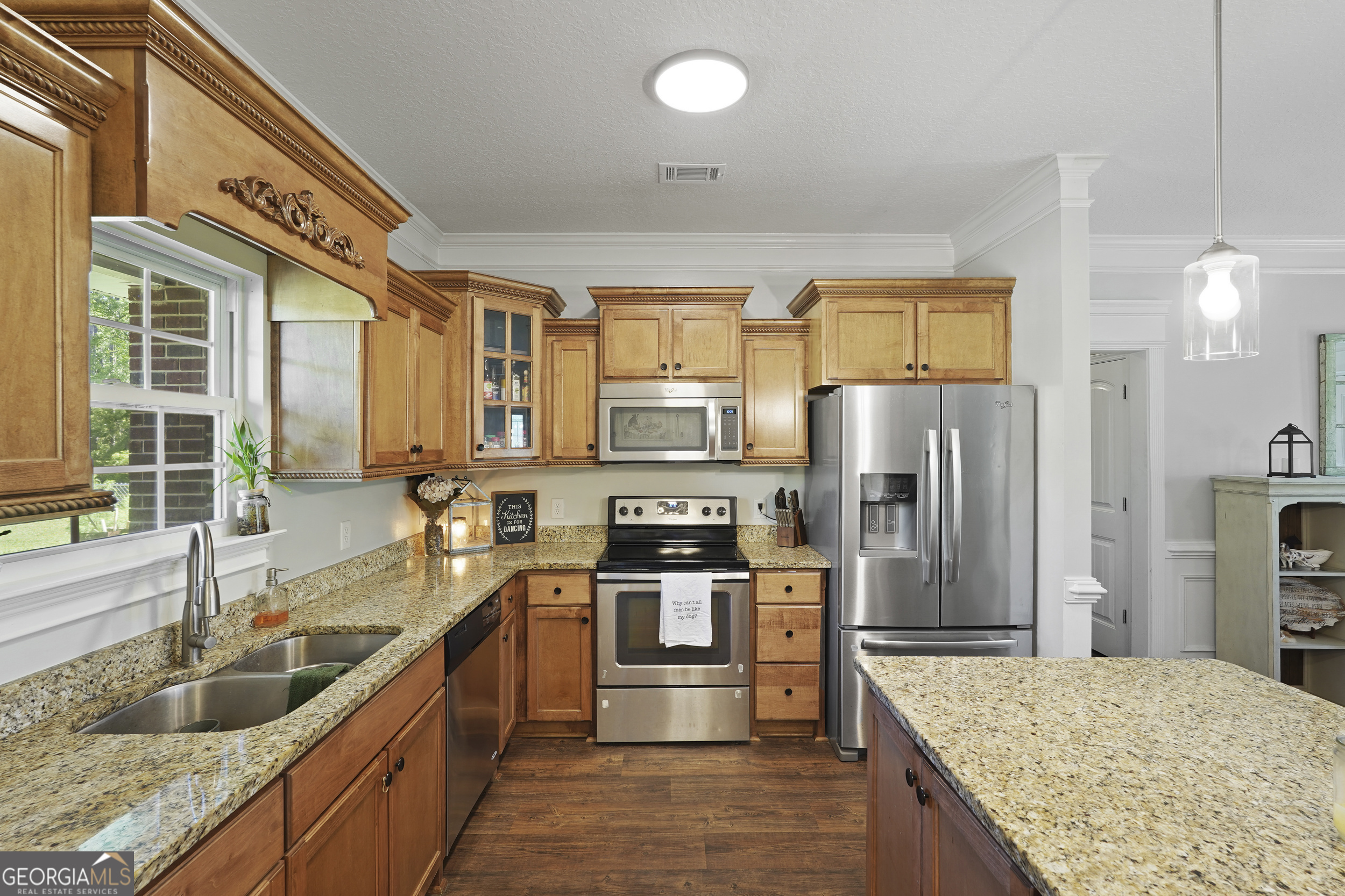 1653 Sutherland Road Townsend, GA 31331 - Photo 26 of 73 a kitchen with stainless steel appliances granite countertop a stove a refrigerator and a sink