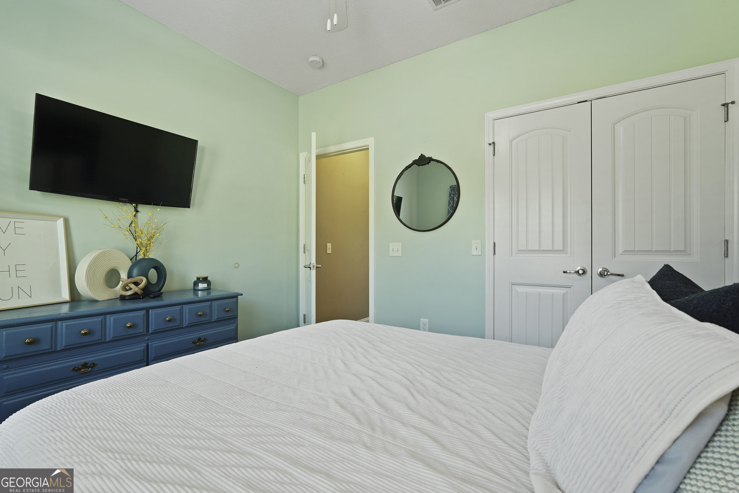 1653 Sutherland Road Townsend, GA 31331 - Photo 32 of 73 a bedroom with a bed and a flat screen tv