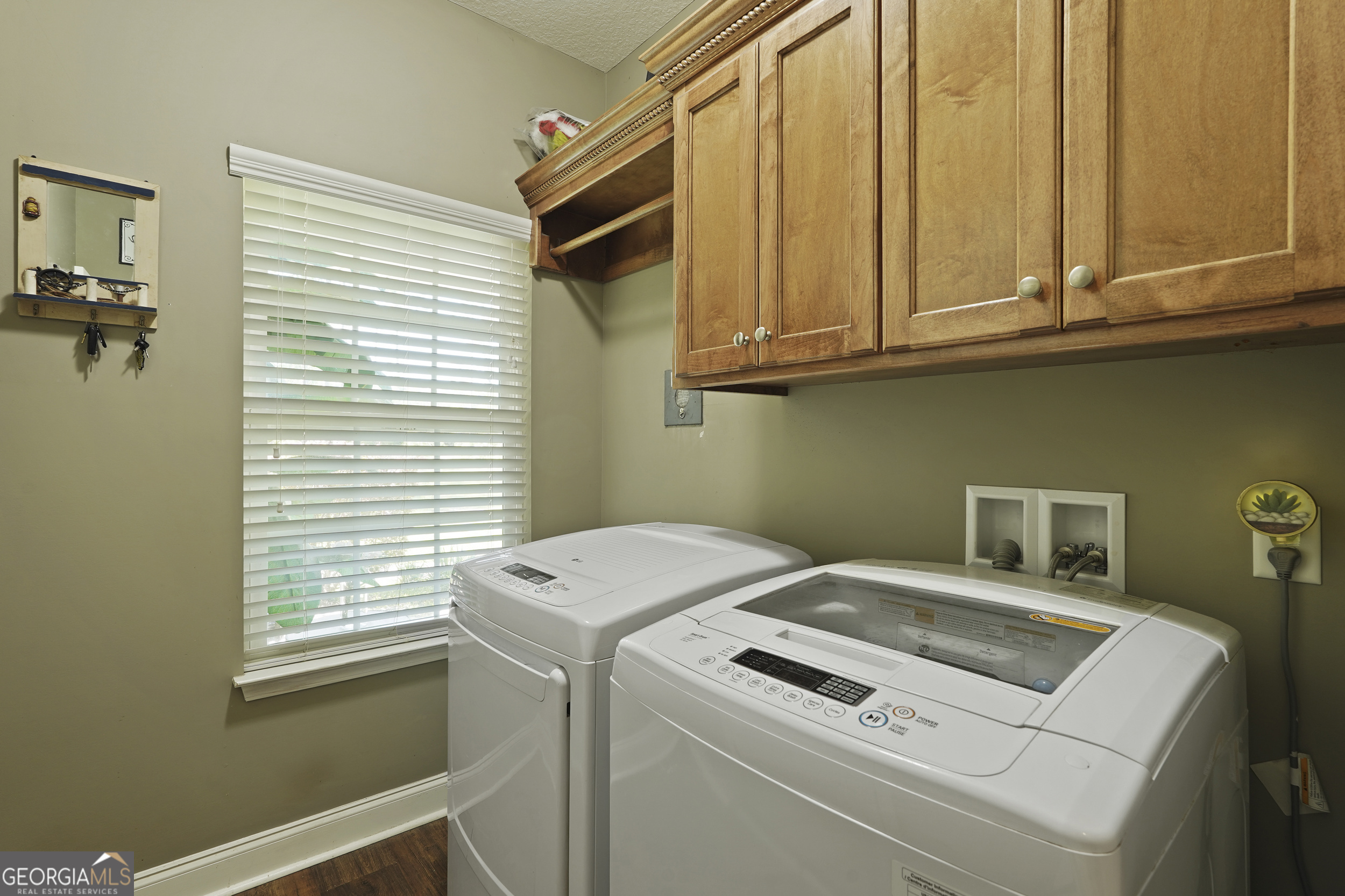 1653 Sutherland Road Townsend, GA 31331 - Photo 33 of 73 a utility room with dryer and washer